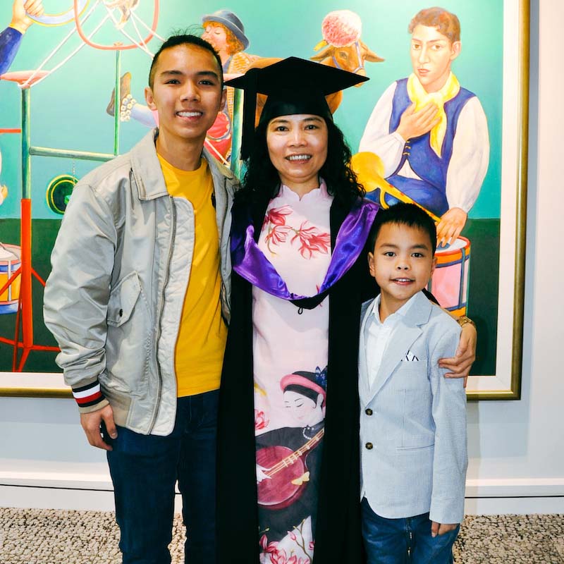Thu Le with her sons on graduation day